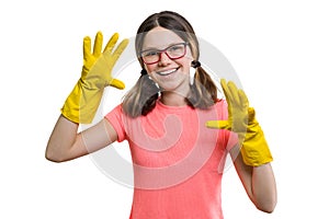 Young smiling cheerful girl in yellow rubber protective gloves, white isolated background