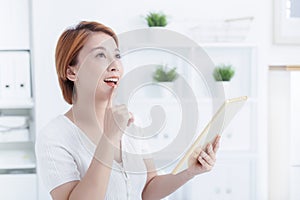 Young smiling employee business woman use hold tablet pc