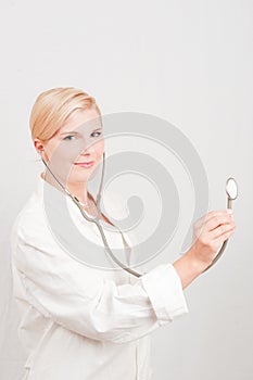 Young smiling female doctor with stethoscope