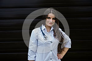 Young smiling female doctor with stethoscope