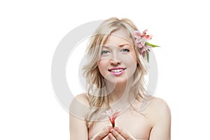Young smiling female with flower in hair