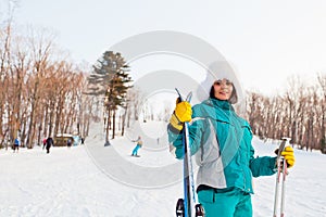 Young smiling female on a ski resort