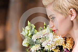 young smiling girl with bouquet