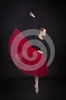 Young,smiling girl dancing the ballet.