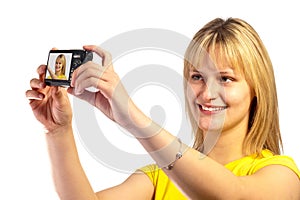 Young smiling girl with a dslr camera