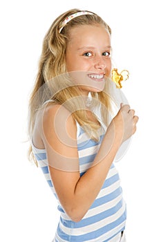 Young smiling girl with lollipop candy