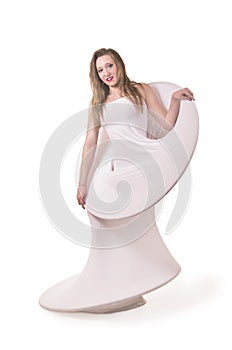 Young, smiling girl with long hair in white conceptual dress .