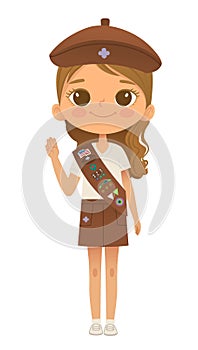 Young smiling girl scout wearing sash