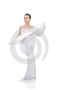 A young,smiling girl in white conceptual dress .