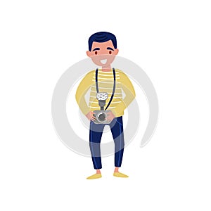 Young smiling man with camera in hand. Professional at work. Cartoon character of photojournalist. Flat vector design