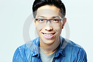 Young smiling man in glasses