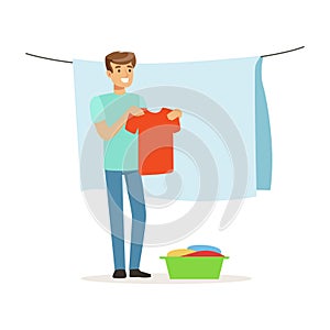 Young smiling man hanging wet clothes out to dry, house husband working at home vector Illustration