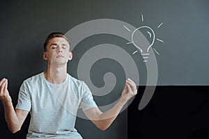 Young smiling man has an idea.Idea concept