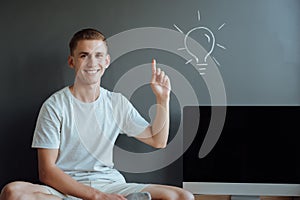 Young smiling man has an idea.Idea concept