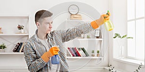 Young smiling man ready to clean home