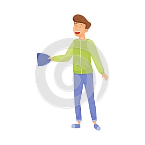 Young Smiling Man Standing and Holding Mask with Sad Face in His Hands Vector Illustration