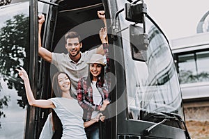 Young Smiling People Traveling on Tourist Bus