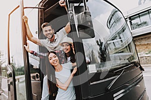 Young Smiling People Traveling on Tourist Bus