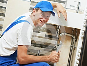 Young smiling plumber man worker