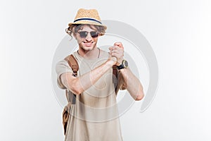 Young smiling stylish man showing well done gesture