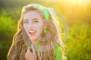 Young smiling summer woman outdoors portrait. Soft sunny colors. Close portrait. Beauty girl face.