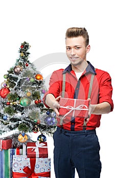 Young smiling vintage man holding gift near