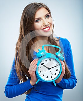 Young smiling woman in blue hold watch. Beautiful smiling girl