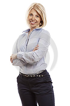 Young smiling woman in a blue shirt and trousers. Business success. Isolated over white background. Vertical