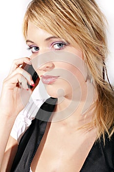 Young smiling woman calling by phone