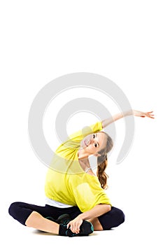 Young smiling woman doing stretching exercises.