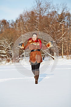 Young smiling woman dressed in sheepskin fur coat photo