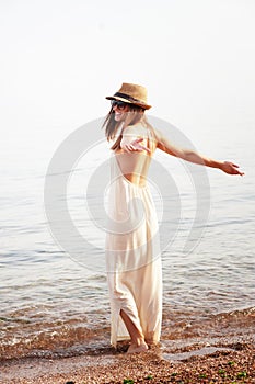 Young smiling woman enjoy summer holidays on a sea beach