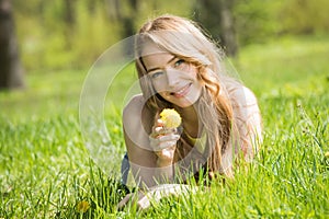 Young smiling woman on grass