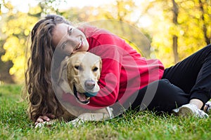 Young smiling woman with her cute dog