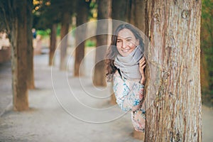 Young smiling woman hiding