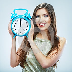 Young smiling woman hold watch. Beautiful smiling girl portrait