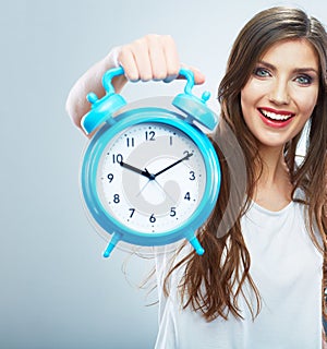 Young smiling woman hold watch. Beautiful smiling girl portrait