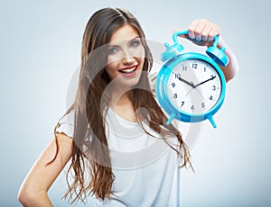 Young smiling woman hold watch. Beautiful smiling girl portrait