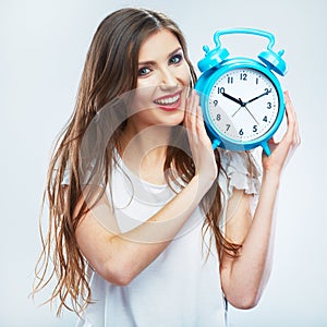 Young smiling woman hold watch. Beautiful smiling girl portrait