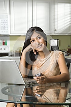 Young Smiling Woman With Laptop and Cellphone