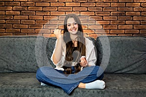 A young smiling woman making make-up