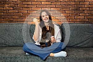 A young smiling woman making make-up