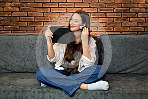 A young smiling woman making make-up