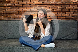 A young smiling woman making make-up