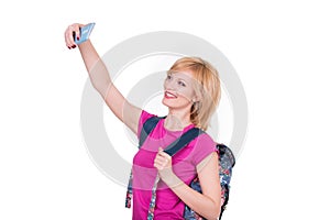 Young smiling woman making selfie with phone