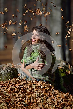 Young smiling woman outdoor in autumn