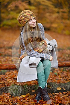 Young smiling woman outdoor in autumn