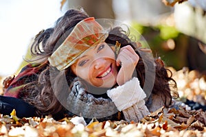 Young smiling woman outdoor in autumn