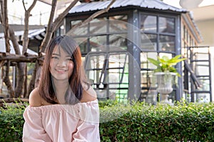 Young smiling woman outdoors portrait. Soft sunny colors.Close portrait. beautiful smiling girl. Woman in the city in summertime.