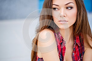 Young smiling woman outdoors portrait.